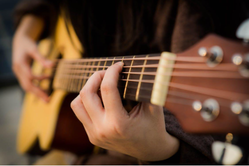 Strumming to Success: 9 Essential Tips for Acoustic Guitar Beginners